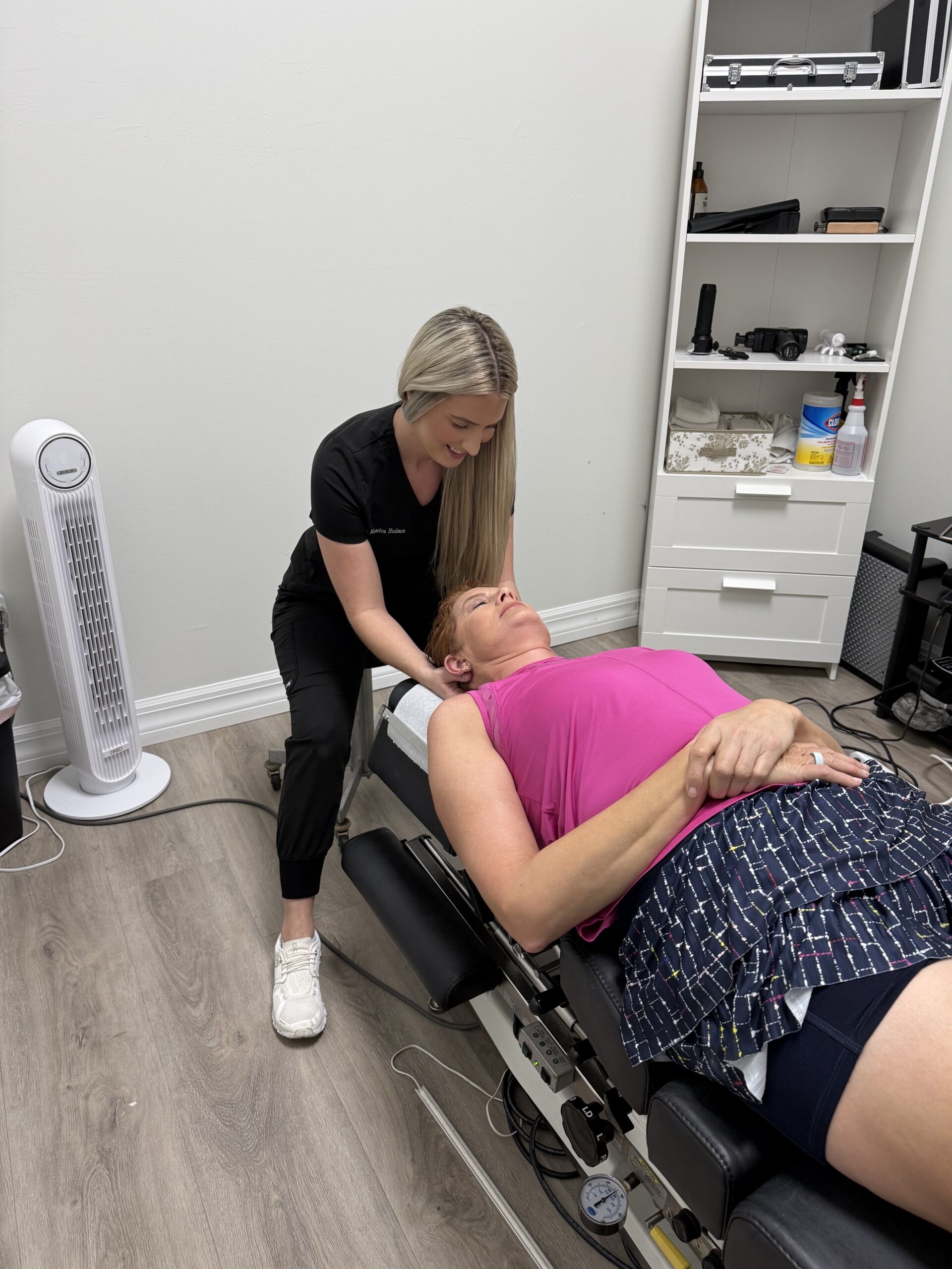 Busy Fort Myers commuter experiencing neck and shoulder tension while waiting at a red light near Bell Tower Nieghborhood